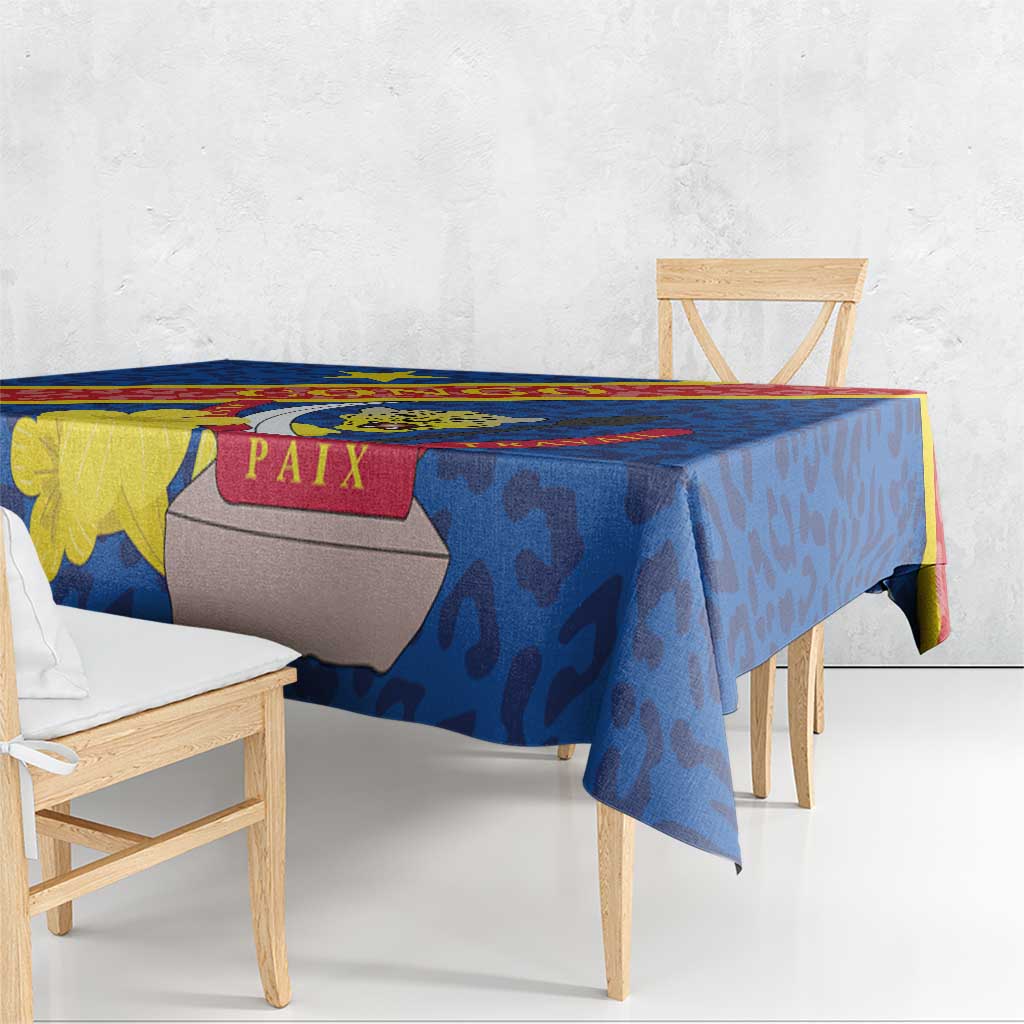 Blue tablecloth with leopard-style pattern and coat of arms, multicolor border