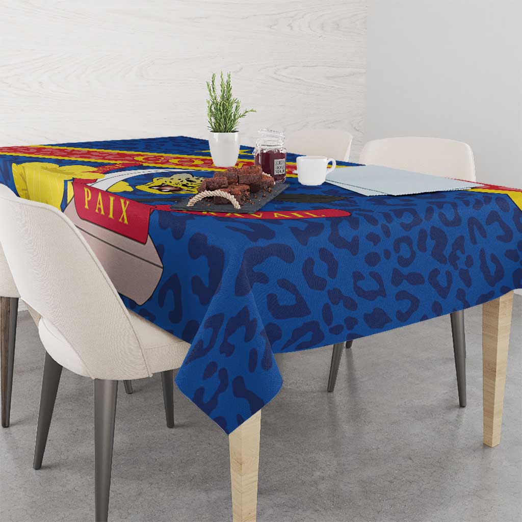Blue tablecloth draped on dining table with coat of arms leopard-style print