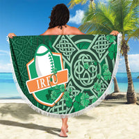 Round green beach blanket with white fringe, Ireland text and shamrock Celtic designs