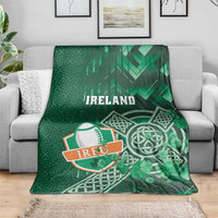 Green Ireland rugby blanket featuring Ireland text, Celtic cross and shamrock print