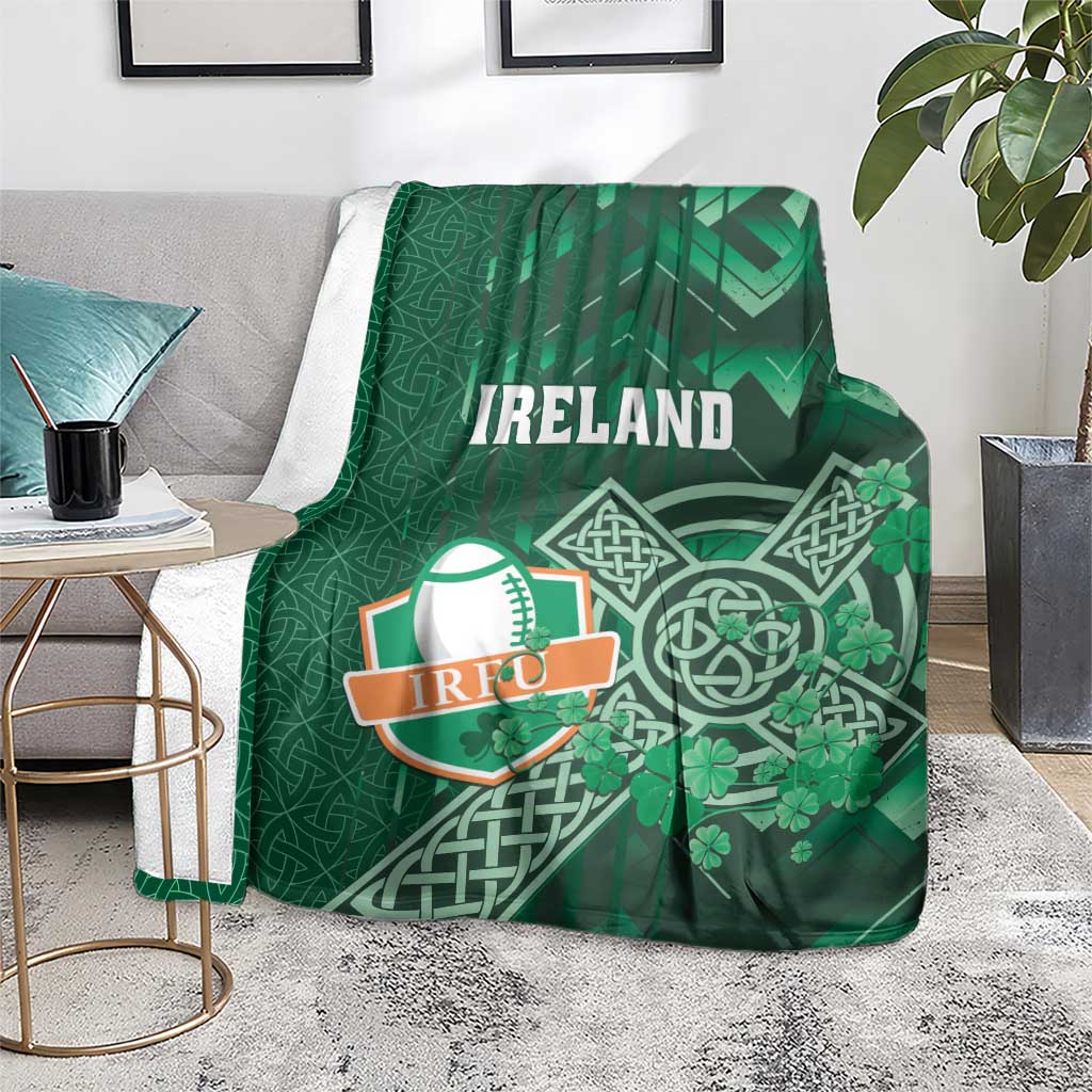 Green Ireland rugby blanket draped over chair with Celtic cross and shamrock artwork