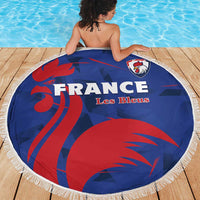 Round blue France Les Bleus beach blanket with red rooster design and white fringe