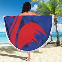 Round blue France rugby beach blanket with red rooster motif and white fringed edge