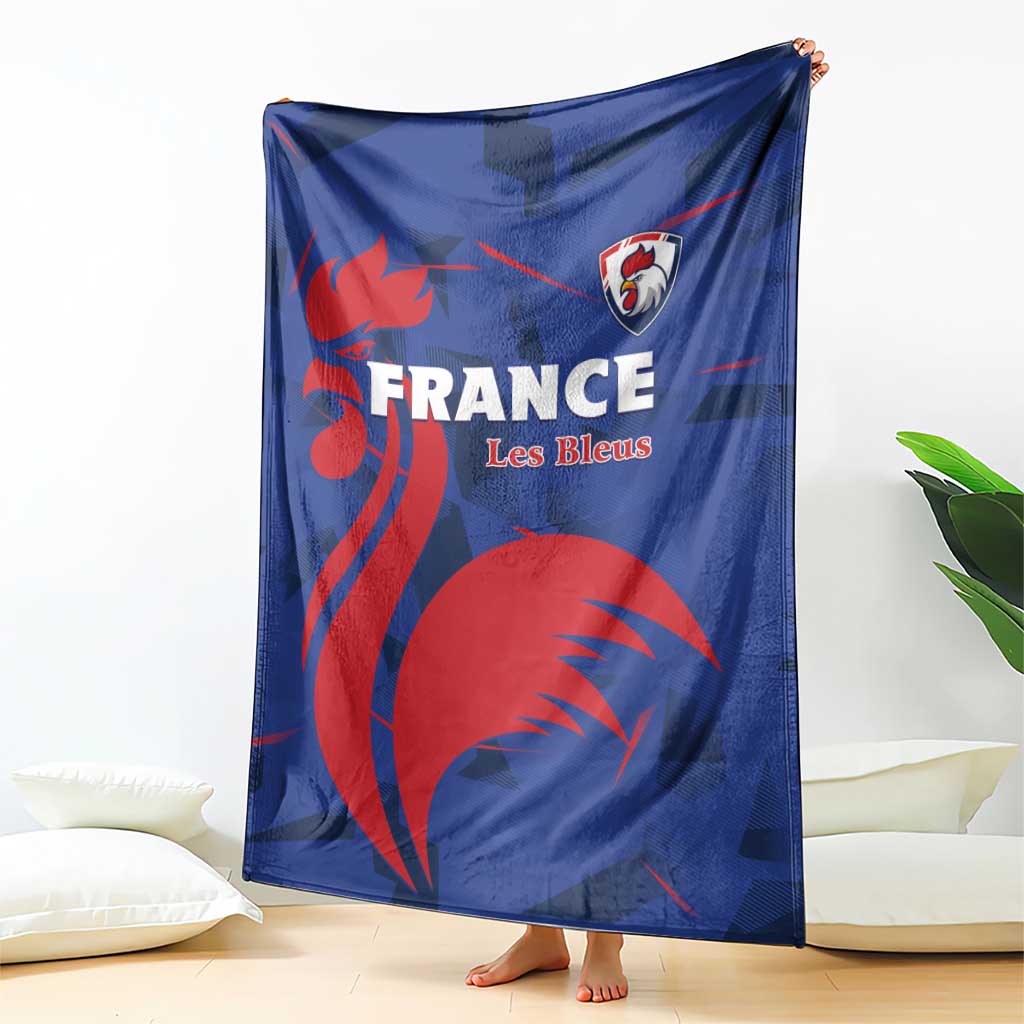 Blue France rugby blanket, red graphic lion and Les Bleus crest, draped on floor