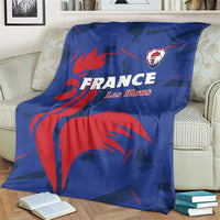 Blue France rugby blanket with red lion design and Les Bleus crest, on armchair