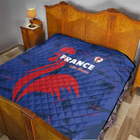 Blue France Les Bleus quilt laid on a bed, red rooster graphic and crest