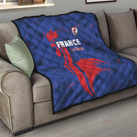 Blue France Les Bleus quilt draped on a sofa with red rooster graphic and crest