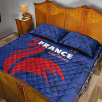 Blue France rugby quilt with red rooster print and black-trimmed edges