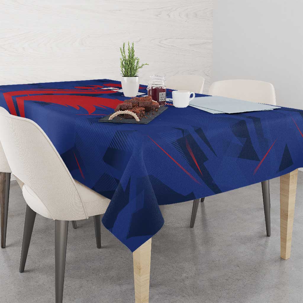 Blue France rugby tablecloth with bold red geometric shapes and abstract pattern on tabletop