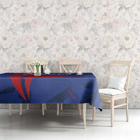 Blue France rugby tablecloth with red and dark navy graphic motif, set on dining table