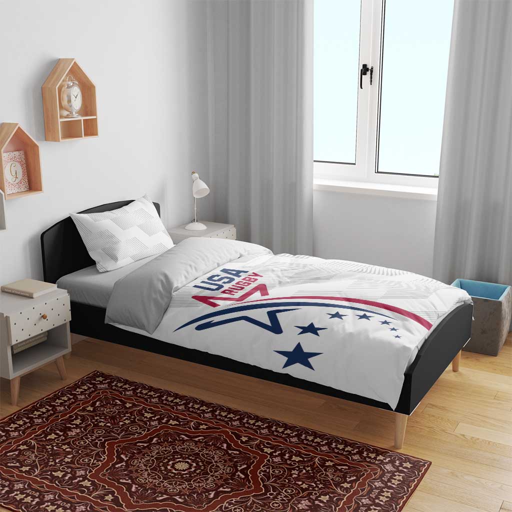 White bedding set on bed frame, USA Rugby logo comforter with matching pillowcase