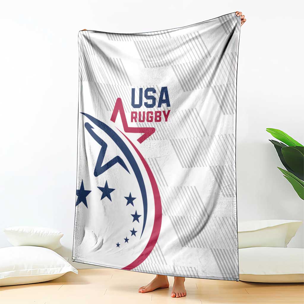 White USA Rugby throw blanket with large USA Rugby emblem, draped on floor