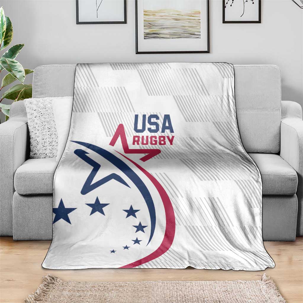 White USA Rugby throw blanket with USA Rugby logo on gray couch