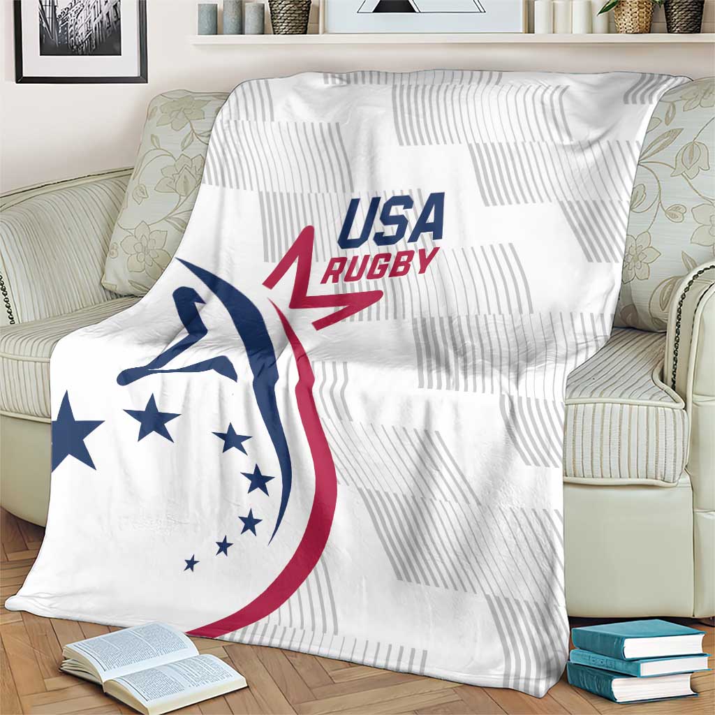 White rugby throw blanket with USA Rugby logo, draped over light sofa