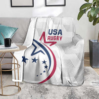 White USA Rugby throw blanket with USA Rugby emblem on gray living room set