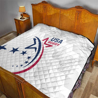 White USA Rugby quilt on bed, quilted diamond pattern with blue red crest artwork
