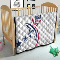 White USA Rugby quilt on crib, quilted diamonds with blue red crest and dark border