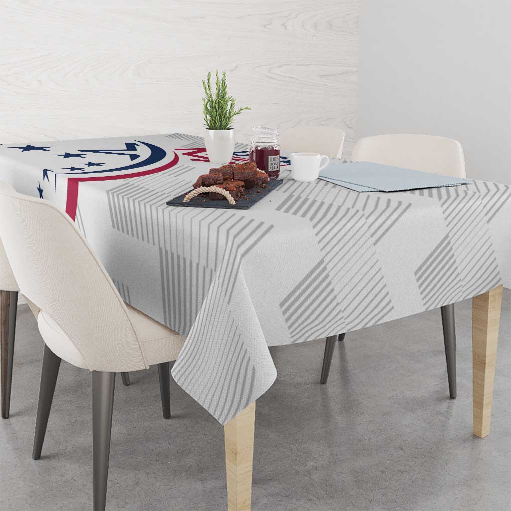 White rugby tablecloth with star and red ribbon graphic across the table surface