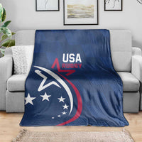 Blue USA Rugby blanket draped on a gray sofa, with eagle and USA stars graphic.