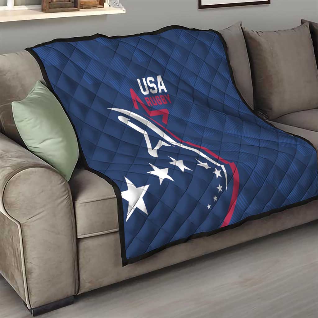 Blue USA Rugby quilt draped over sofa, quilted pattern with eagle emblem