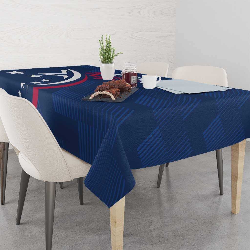 Blue rugby tablecloth with USA logo and red slash, set across a dining table