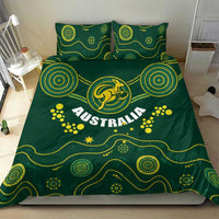 Green duvet cover and matching pillowcases with yellow Australia crest and circular motifs
