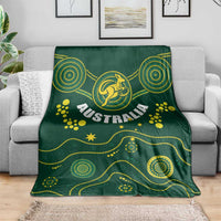 Green Australia rugby blanket featuring Wallabies kangaroo emblem on a couch