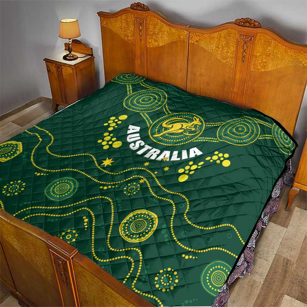 Australia rugby quilt on bed, dark green with yellow Wallabies emblem, Australia lettering, waves