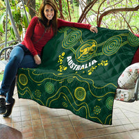 Australia rugby quilt draped on sofa, dark green with yellow Wallabies crest and Australia