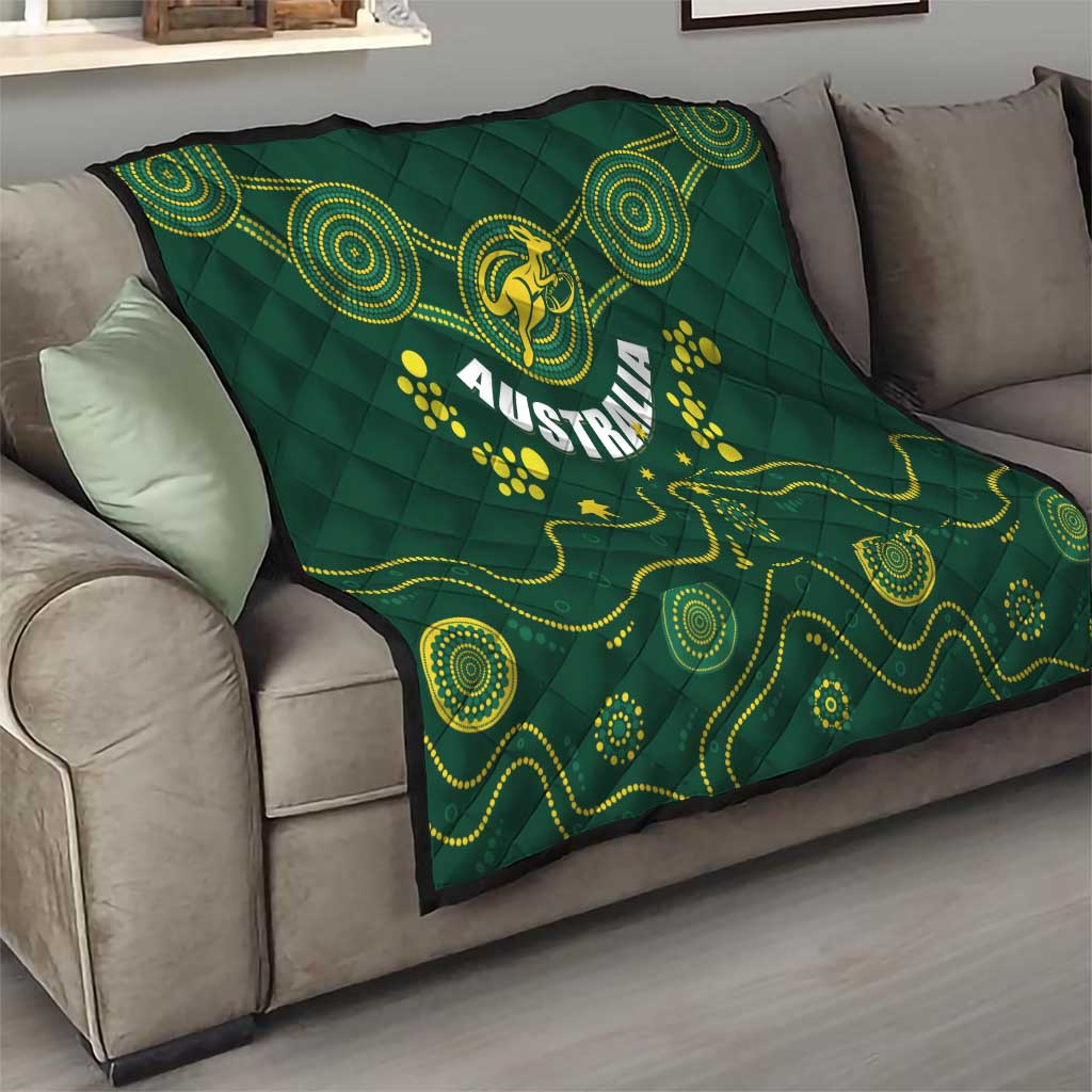 Australia rugby quilt on couch, dark green with yellow crest, Australia text, and spiral accents