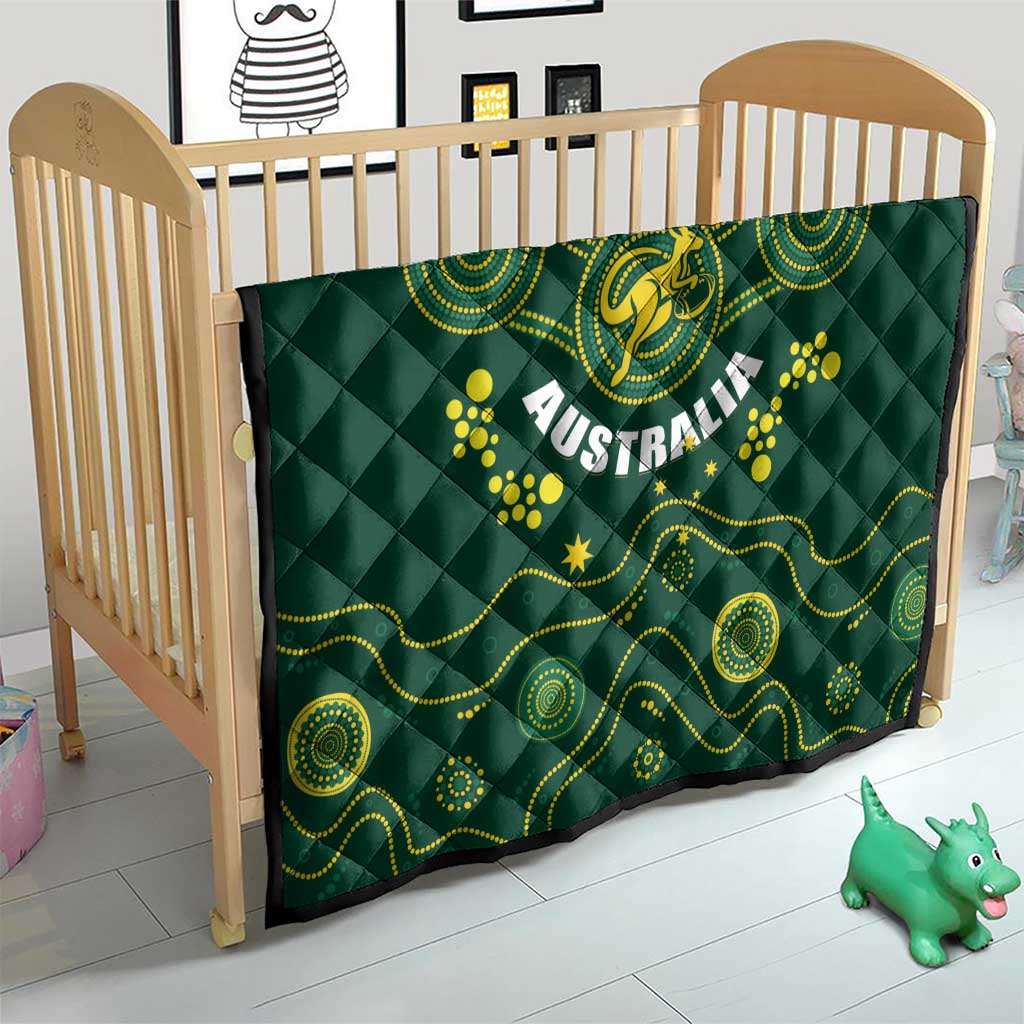 Australia rugby quilt on crib, dark green with yellow Wallabies emblem and Australia lettering