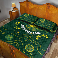 Green quilt bed set with Australia lettering, kangaroo emblem, and yellow dotted trails; two pillows