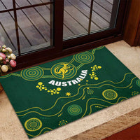Green rubber doormat on entry step with yellow 'AUSTRALIA' and dot swirl accents