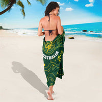Green rugby sarong with Wallabies logo and circular dot design, back view