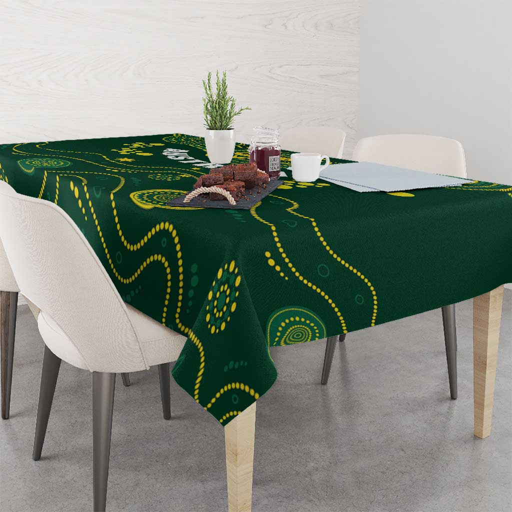 Green rugby tablecloth with yellow wave and dot design, on a dining table