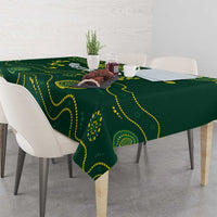 Green rugby tablecloth with yellow wave and dot design, on a dining table