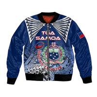 Blue bomber jacket with black ribbed hem, zipper front, and Polynesian emblem graphic