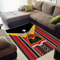 Rectangular area rug with black field, red and cream stripes, star and Timor-Leste crest