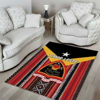 Rectangular area rug with red, black, and cream striped design and central Timor-Leste emblem