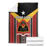 Folded Timor-Leste flag blanket, black with yellow star and red stripe pattern, with white rolls
