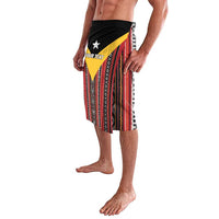 Red patterned lavalava sarong with black waistband and custom text panel detail
