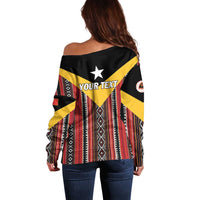 Off-shoulder sweater with custom text and black, yellow, red geometric pattern