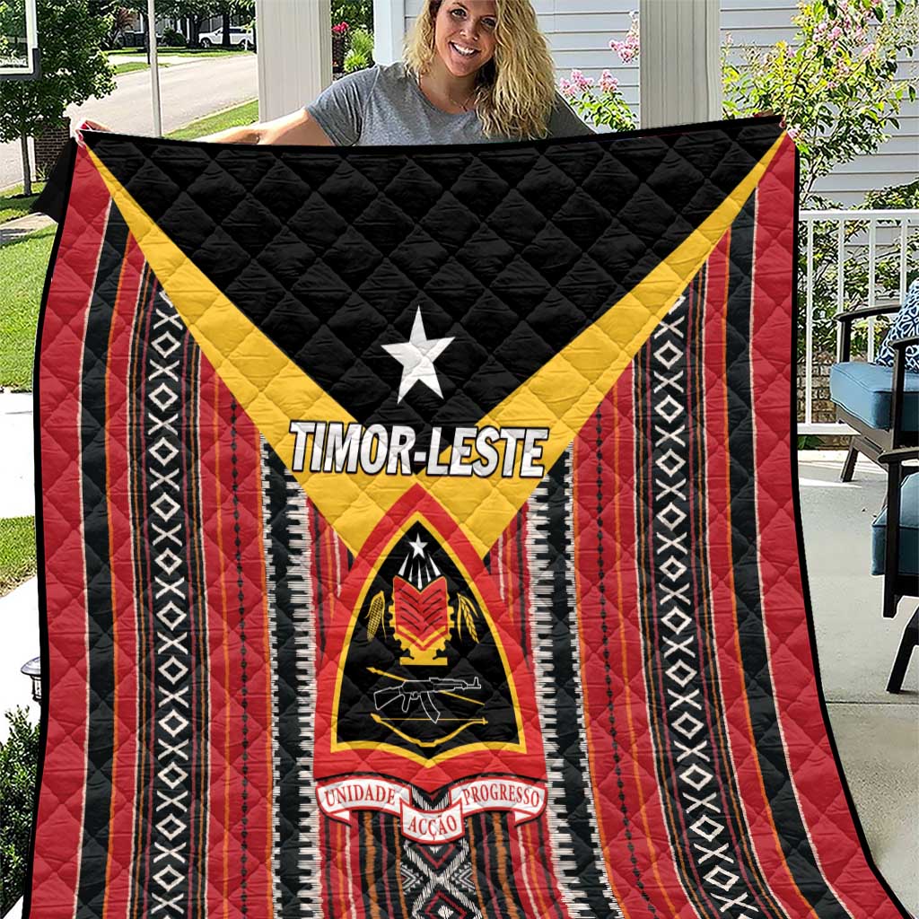 Red, black and white quilt with yellow chevron, central star, and shield emblem