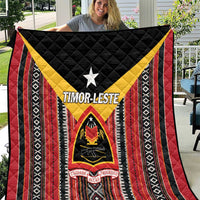 Red, black and white quilt with yellow chevron, central star, and shield emblem