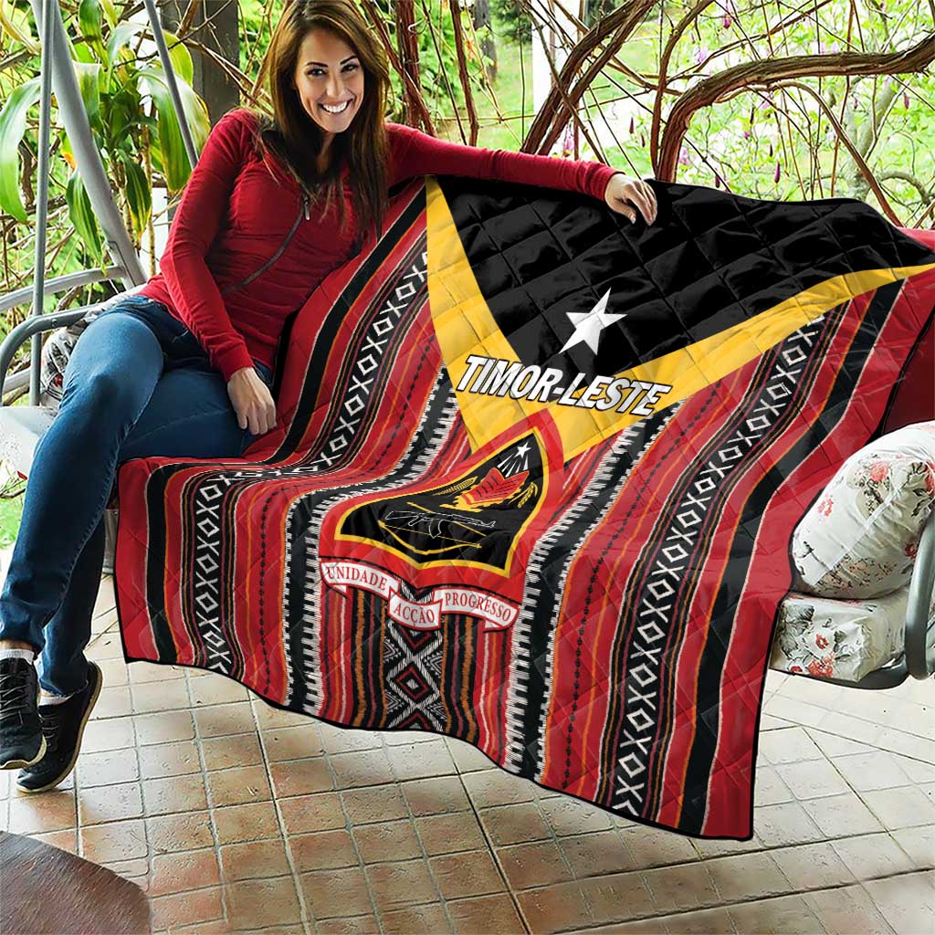 Red, black, and white quilt with yellow frame, central star, and emblem patch graphics