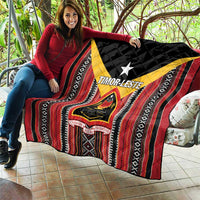 Red, black, and white quilt with yellow frame, central star, and emblem patch graphics