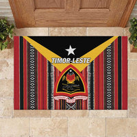 Rubber doormat with black base, red and yellow striped Timor-Leste pattern and central crest