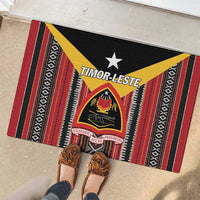 Rubber doormat with black base, red and yellow striped design, white star and crest emblem