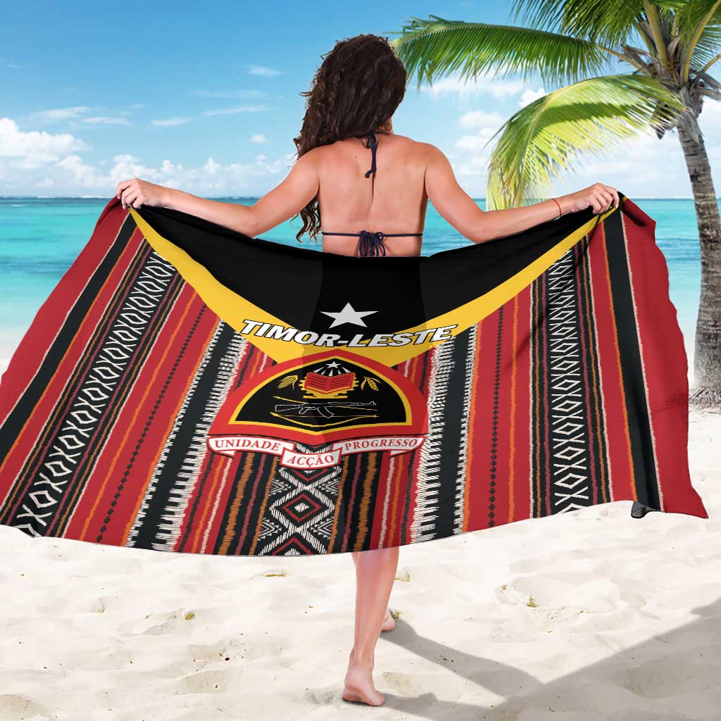 Red and black striped sarong with yellow edging and central TIMOR-LESTE crest