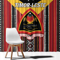 Black curtain panel detail with Timor-Leste shield emblem in red, yellow, and white